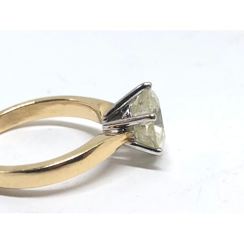 203 - A diamond solitaire ring, the stone weighing approx. 2.46ct, hallmarked 18ct gold band, gross wt. 4.... 