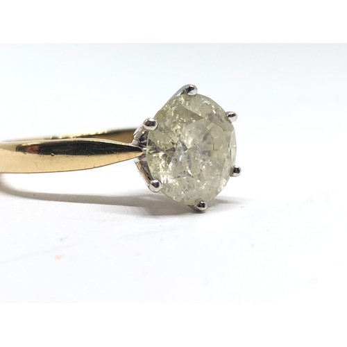 203 - A diamond solitaire ring, the stone weighing approx. 2.46ct, hallmarked 18ct gold band, gross wt. 4.... 