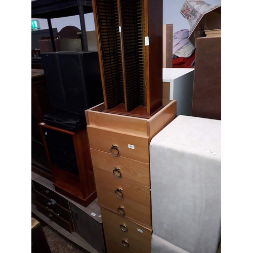 861 - A pair of pine veneered bedside drawers and a cd rack