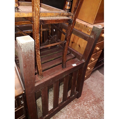 863 - A pair of stained wooden garden armchairs