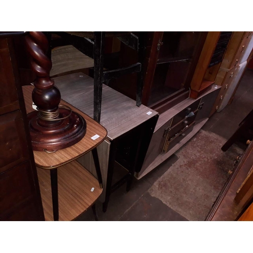 864 - A retro melamine low sideboard, matching drop leaf table and two chairs and a pair of retro side tab... 