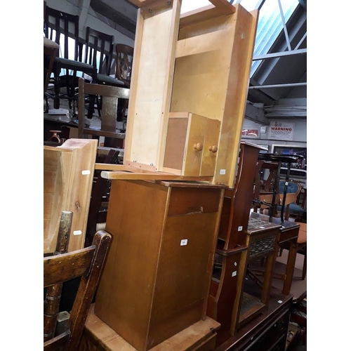 868 - An oak bedside cabinet and a lightwood child's school desk.