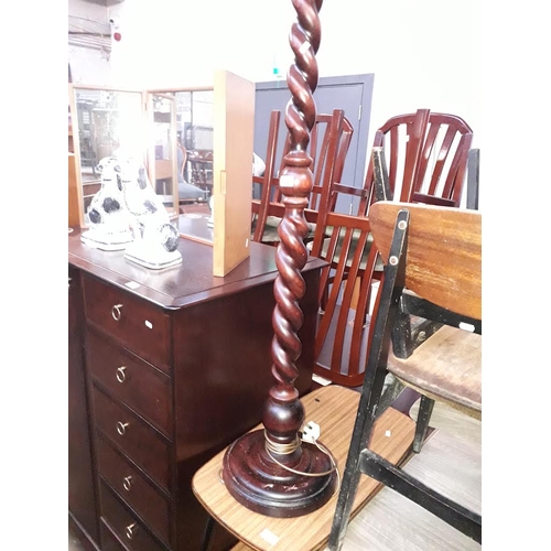 871 - A stained pine twist pillar standard lamp.