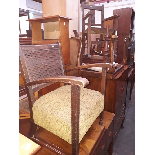 886 - A bergere back oak framed armchair, an oak child's rocker and two stools.