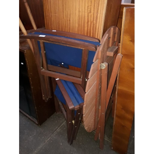 894 - A stained teak patio table and pair of directors chairs.