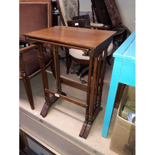 926 - An Edwardian nest of two oak tables