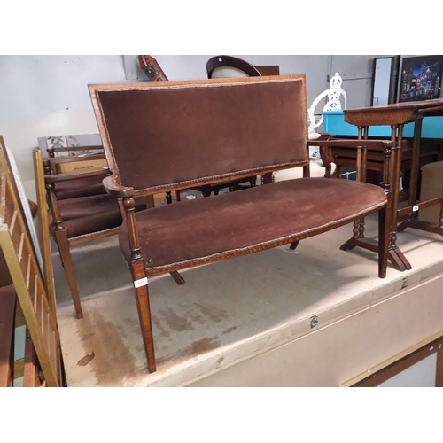 927 - An Edwardian inlaid mahogany salon suite comprising a two seater settee and two armchairs