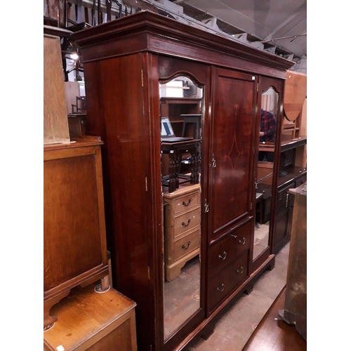 931 - An edwardian inlaid mahogany triple wardrobe