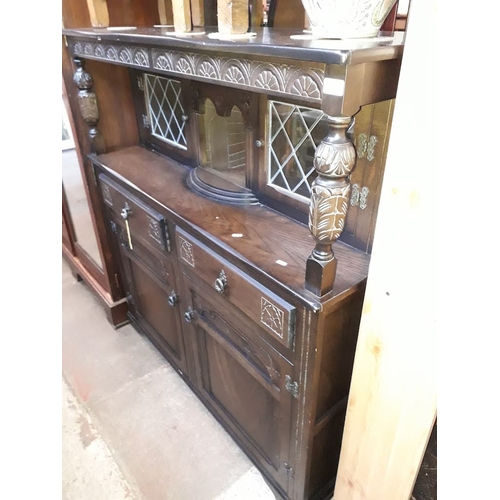 938 - A reproduction oak court cupboard