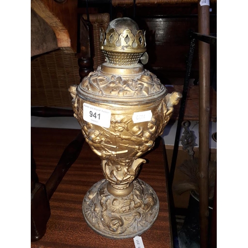 941 - A guilt spelter oil lamp with colonial scene