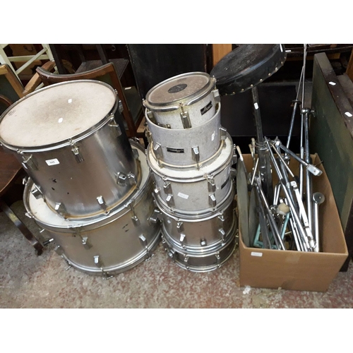 946 - A drum kit including seat, 3 drums labled 'Maxwin'.