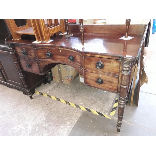 953 - Regency period mahogany sideboard with turned legs and concave centre drawer