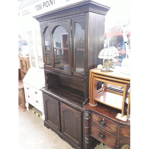 955 - An oak glazed cabinet bookcase