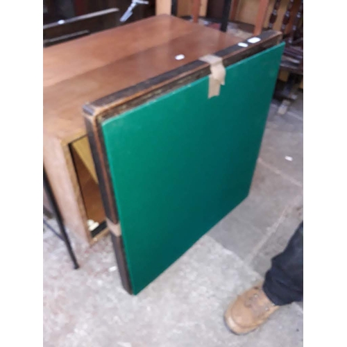 958 - A baize top folding card table