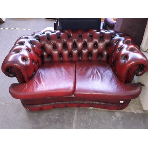 966 - An oxblood leather Chesterfield two seater settee