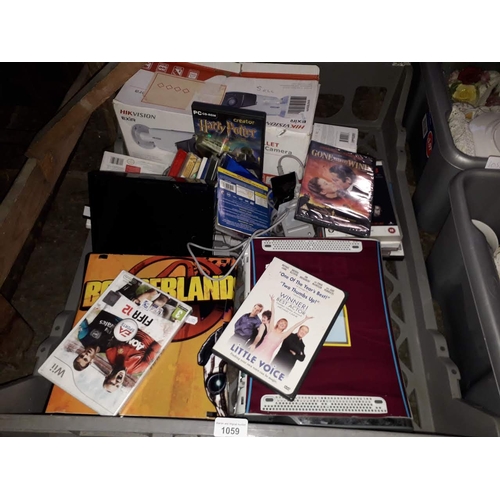 1059 - A crate containing an 2 xbox 360 consoles, Nintendo Wii and various games, HIKVision network camera,... 