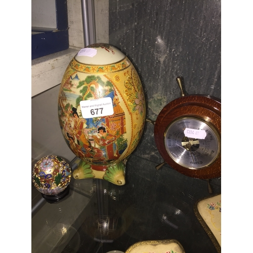 677 - Two repro eggs and a barometer