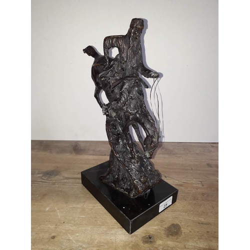 25 - A modern bronze depicting a Native American riding a bucking horse on marble base, height 34cm.