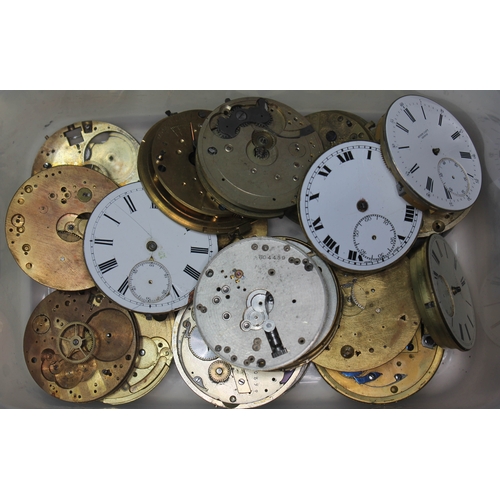 105 - A tub of various pocket watch movements, dials and parts - spares. (vendor collected)