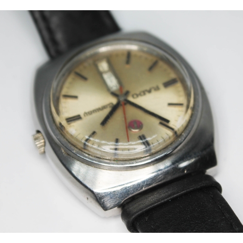 109 - A vintage stainless steel Rado Conway automatic wristwatch with signed champagne dial, red center sw... 