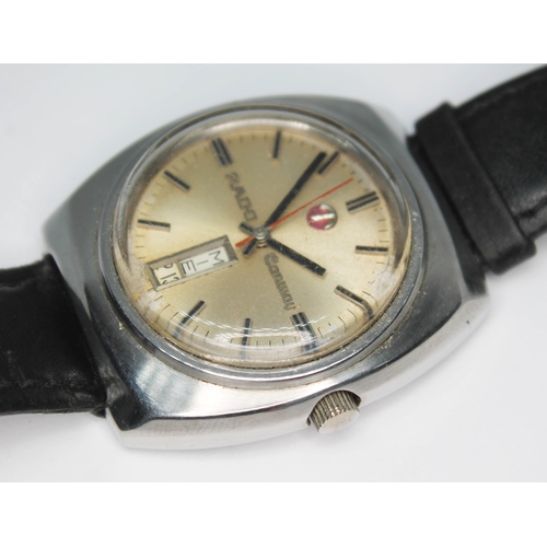 109 - A vintage stainless steel Rado Conway automatic wristwatch with signed champagne dial, red center sw... 