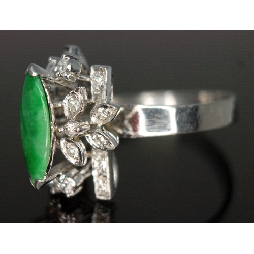 112 - A jade and diamond cocktail ring, the central marquis shaped jadeite jade cabochon measuring approx.... 