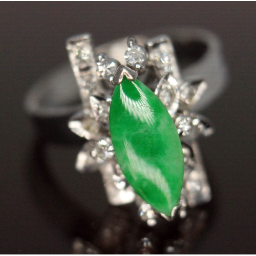 112 - A jade and diamond cocktail ring, the central marquis shaped jadeite jade cabochon measuring approx.... 