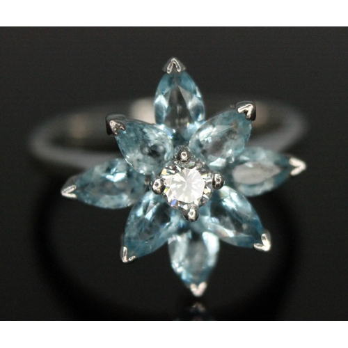 113 - A diamond and aquamarine cocktail ring, the central modern round brilliant cut stone weight approx. ... 