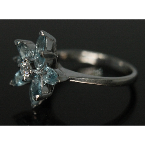 113 - A diamond and aquamarine cocktail ring, the central modern round brilliant cut stone weight approx. ... 