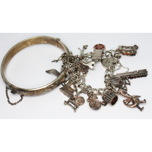 138 - A hallmarked silver charm bracelet and a hallmarked silver bange, gross wt. 73.72g.