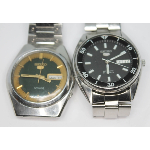 244 - Two vintage stainless steel Seiko 5 day date wristwatches comprising a 7S26-1420 black dial 21 jewel... 
