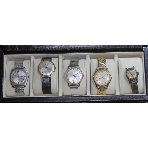 249 - A collection of five vintage mechanical wristwatches in a watch display case comprising of a Timex H... 