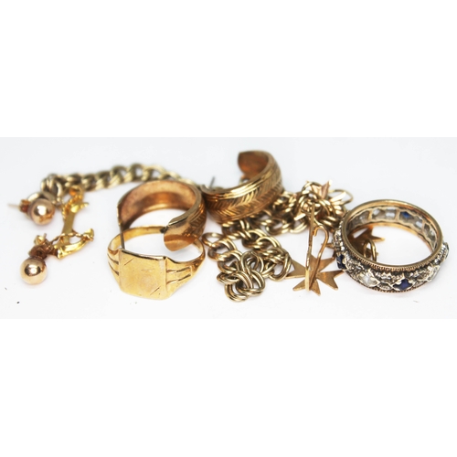 251 - A mixed lot of gold and yellow metal including a chain marked 9c, an eternity ring set with blue and... 