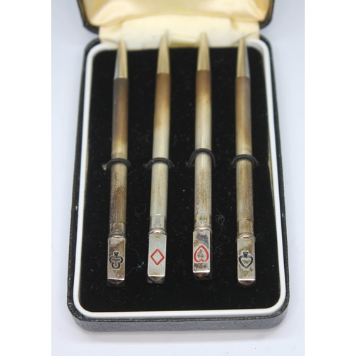 253 - A cased set of four Sterling Silver bridge pencils.