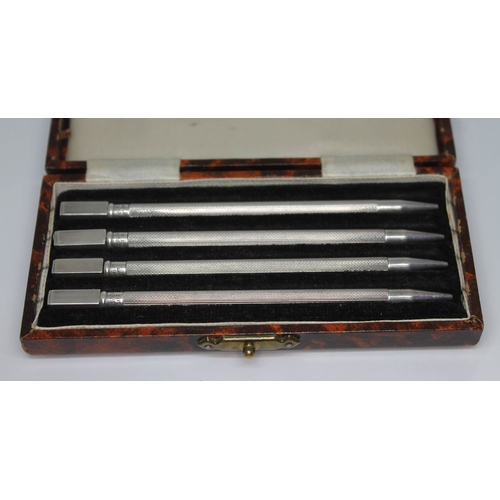 263 - A cased set of four Sterling Silver bridge pencils.
