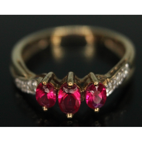 287 - A synthetic ruby and diamond ring, marked '9ct', gross wt. 1.73g, size J.