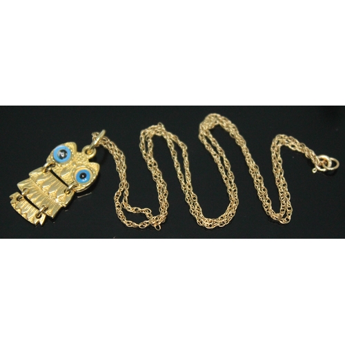 292 - A novelty pendant modelled as an owl marked '585', on 38cm chain marked '9K', gross wt. 2.93g.