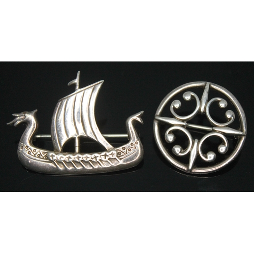298 - Two Scottish brooches by Ola M Gorie, one hallmarked silver formed as a Viking ship, and the other o... 
