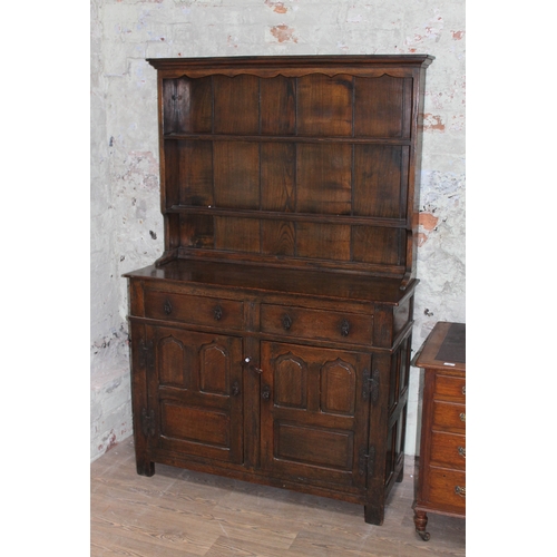 62 - A joined oak dresser in the manner of Titchmarsh & Goodwin, 20th century, width 121cm, depth 46.5cm ... 