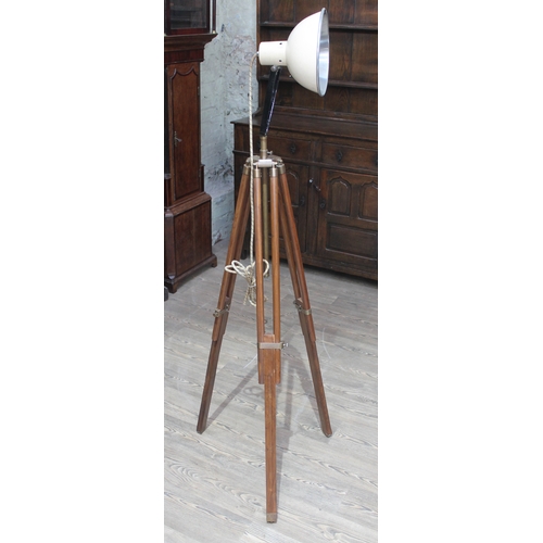 72 - An adjustable angle lamp on tripod base.