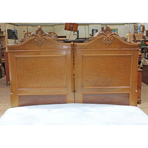 85 - A continental birds eye maple double bed circa 1900, the heads with carved scrolls, with super king ... 