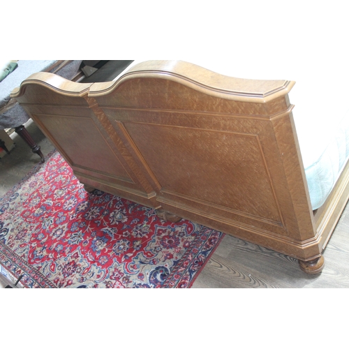 85 - A continental birds eye maple double bed circa 1900, the heads with carved scrolls, with super king ... 