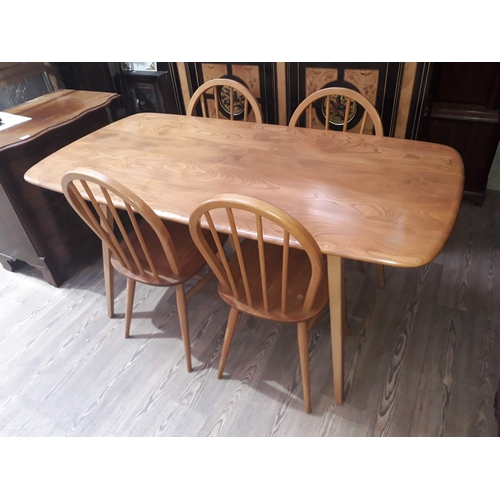 77 - An Ercol blonde elm and beech table and four chairs.