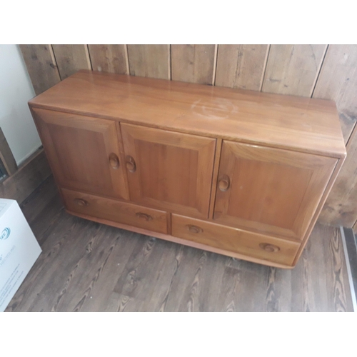 78 - An Ercol blonde elm sideboard.