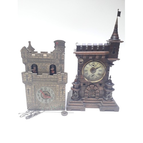 86 - Two novelty wall clocks formed as castles, one marked Paico England.