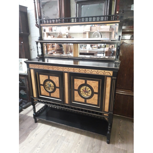 76 - A Victorian Aestehtic Movement ebonised cabinet circa 1885 with mirror back, parcel gilt and inlaid ... 