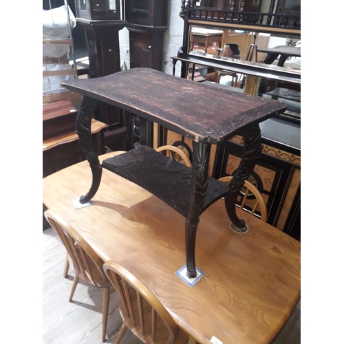 84 - An eastern carved table, height65cm.