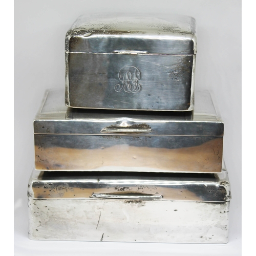 95 - A group of three hallmarked silver cigarette boxes.