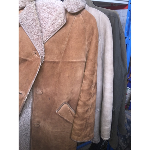 124 - Four coats, including two sheepskin, a wax jacket and a coney/ rabbit fur