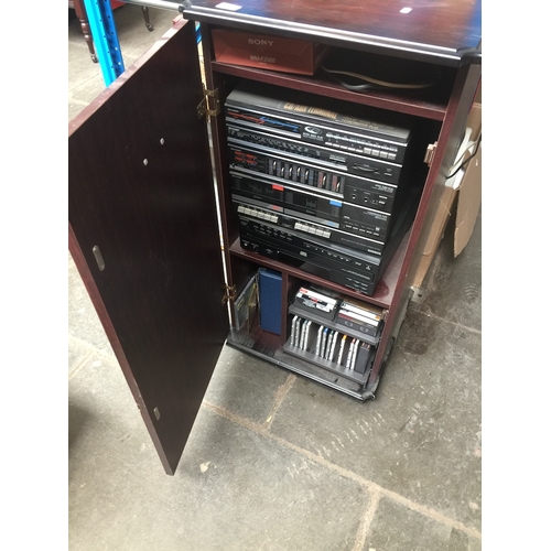 158 - A wooden cabinet containing Sharp hi-fi system, a Sony 5 disc automatic disc loading system, a Sony ... 